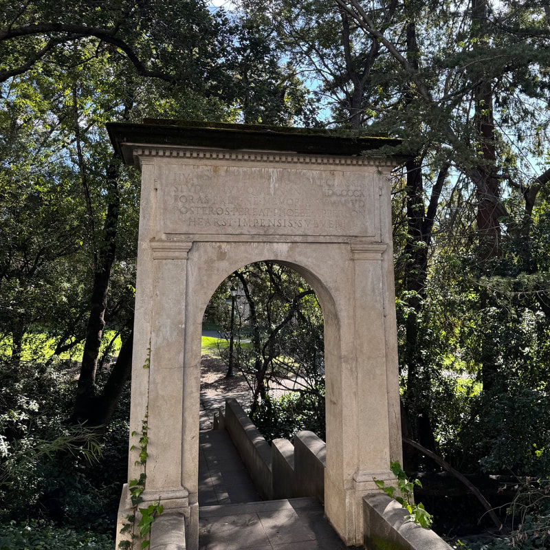 Classical stone archway in natural setting
